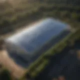 Aerial view of a modern greenhouse with solar panels