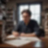 A graduate contemplating their research at a desk filled with books and notes